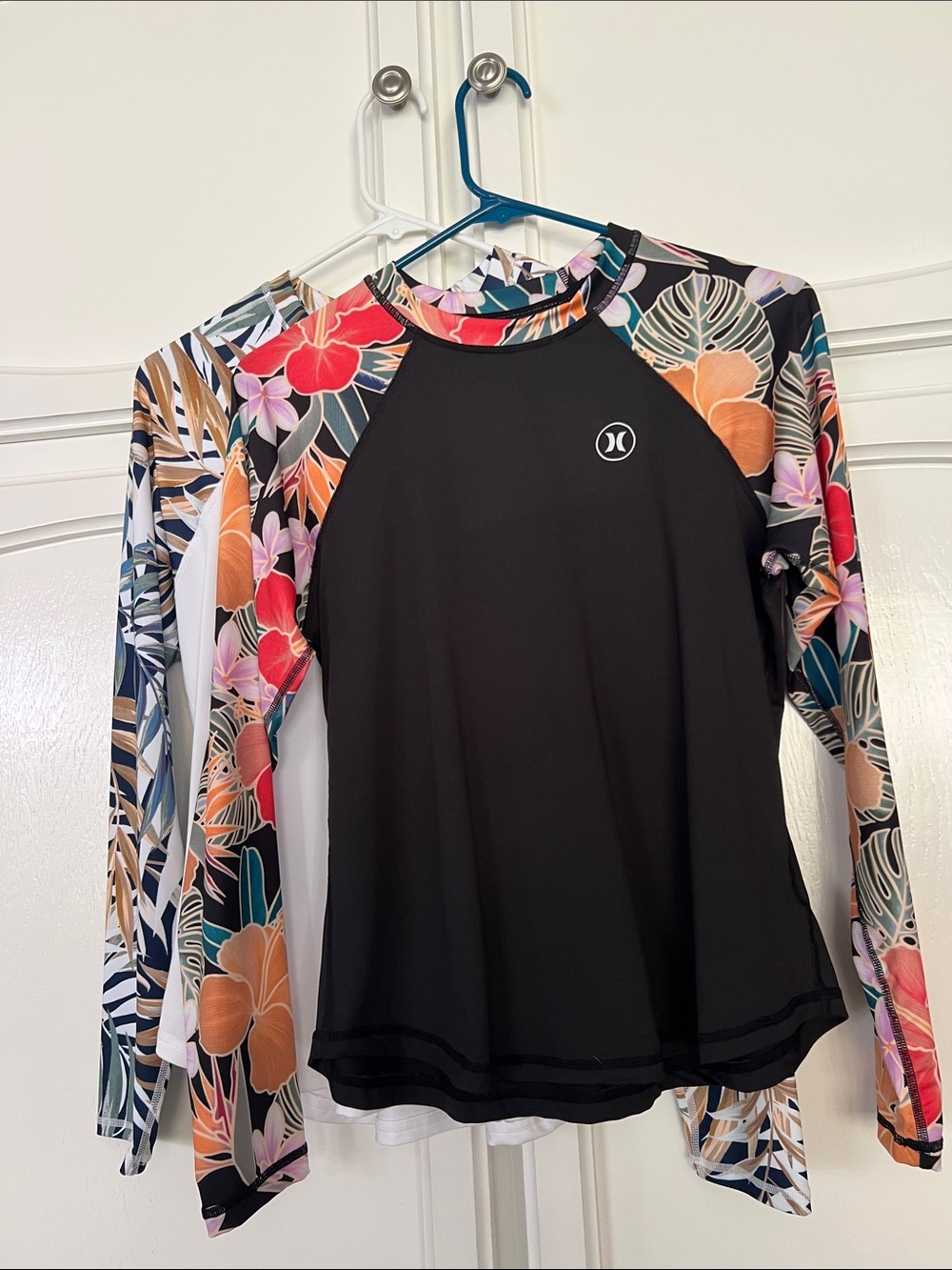 Hurley UPF 50 Black Long-Sleeve Swim Tees with Tropical Floral Raglan Sleeves.